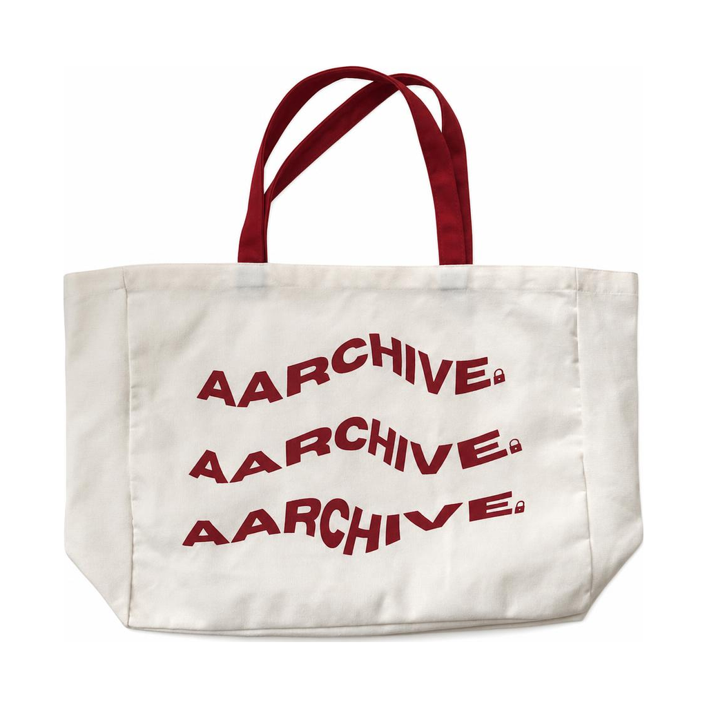 Cream AARCHIVE tote bag with red handles and three red AARCHIVE logos