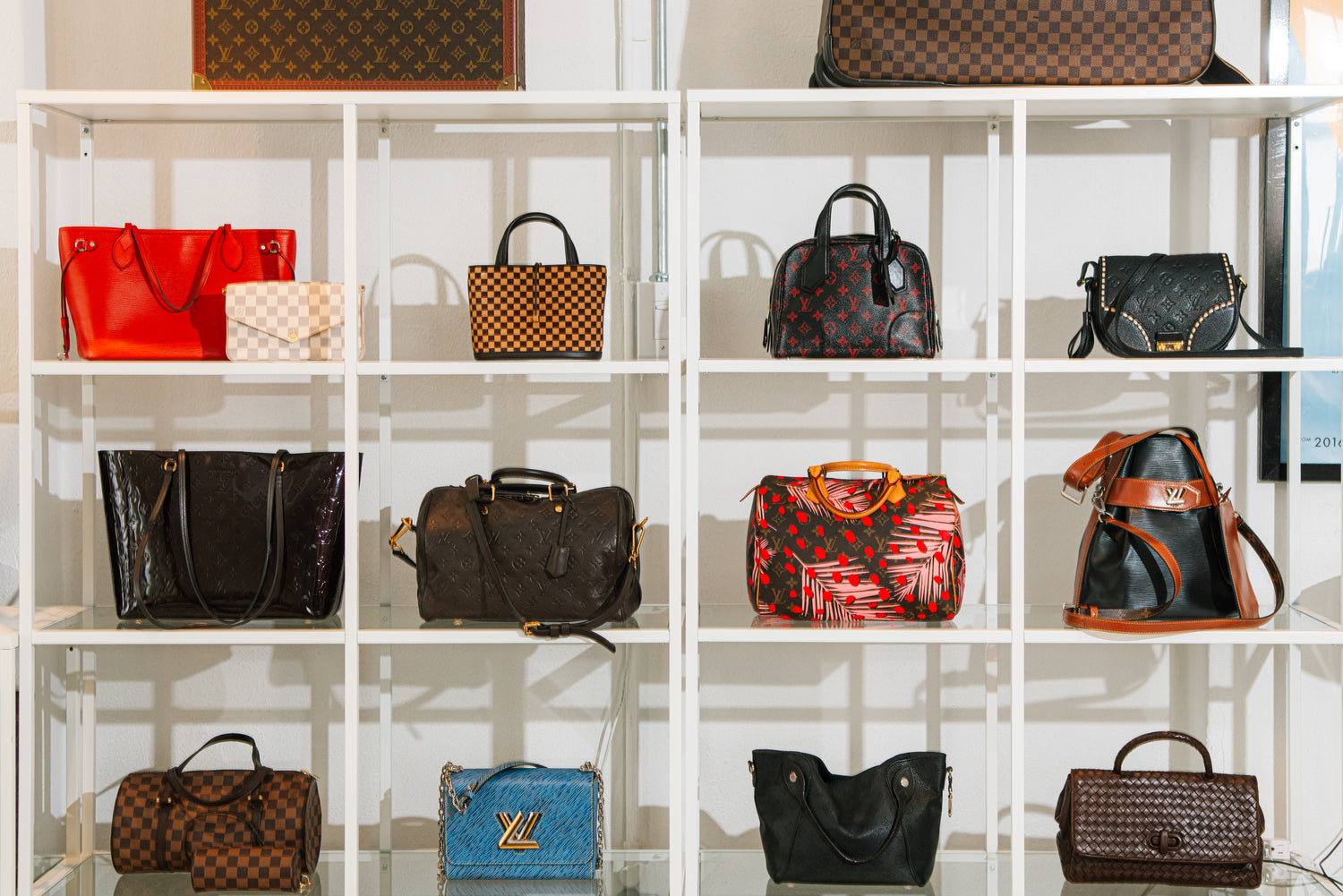 Designer bags displayed on AARCHIVE showroom shelves